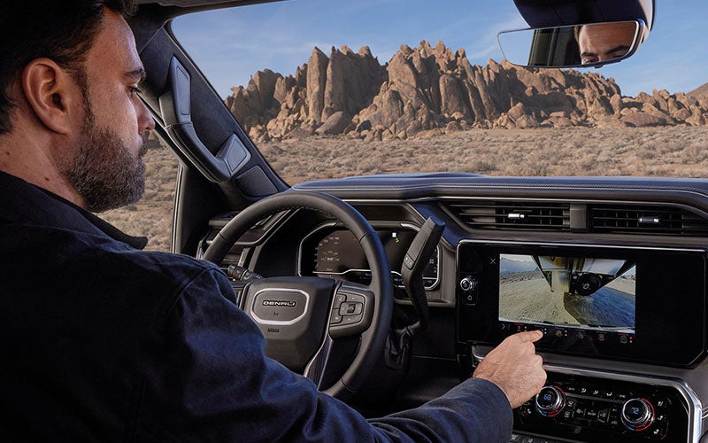 Customer Test Driving a GMC Sierra Denali